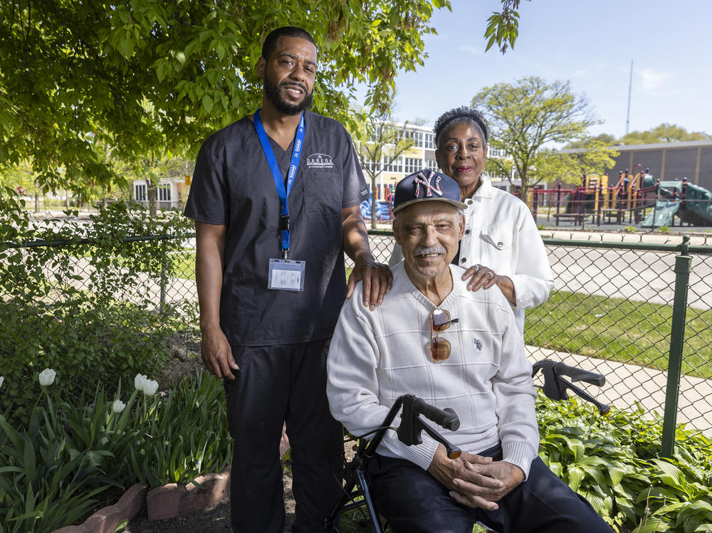 George and Gladys Smith and their son George Jr. live across the street from the now-shuttered Woods Elementary in Englewood, Ill. Members of the Smith family have lived on the block since 1883. They say the area was in decline and the population dropping before 2013, but the closing of Woods was a turning point.