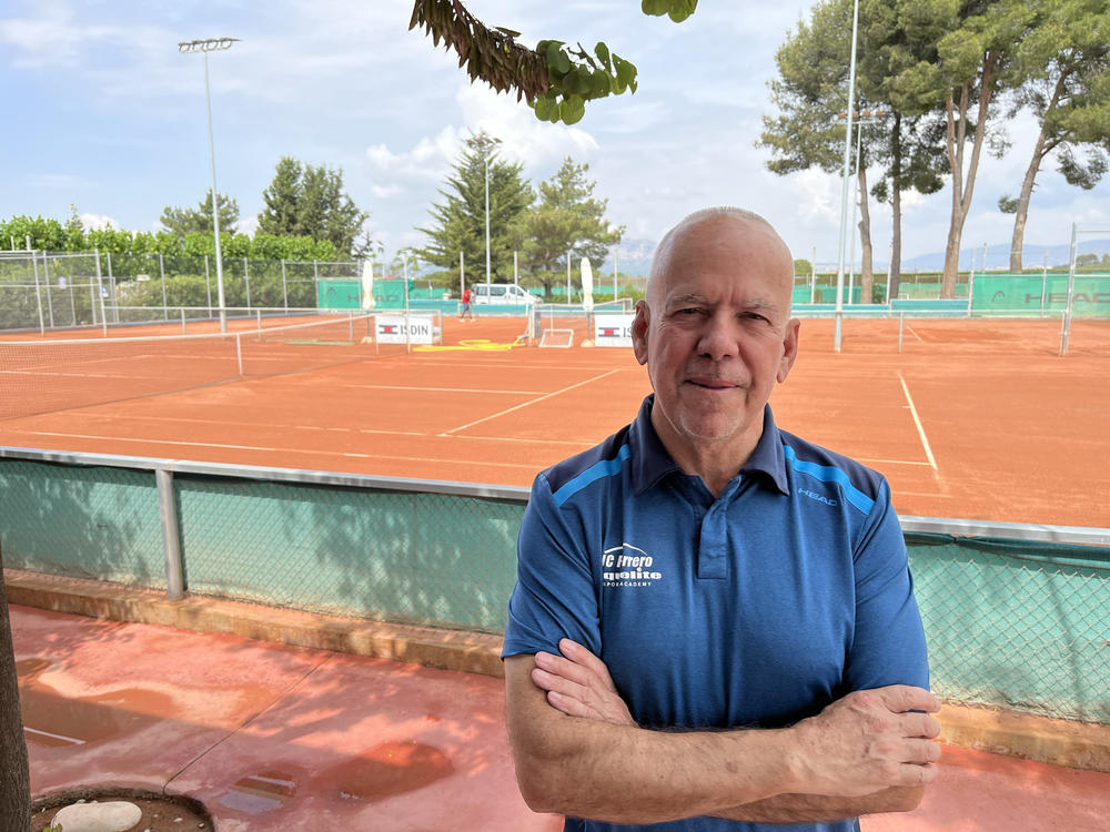 Antonio Cascales stands at the tennis academy he co-founded with the player he coached to #1 in the world, Juan Carlos Ferrero. The Juan Carlos Ferrero Equelite Sport Academy is located in the countryside near the southern Spanish town of Villena, Cascales' hometown, and the current #1 player in the world, Carlos Alcaraz lives and trains there.