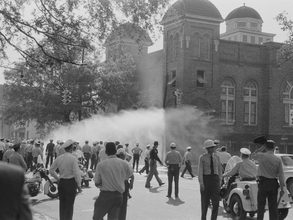 Police officers and firefighters converge on 16th Street Baptist Church, a gathering spot for protesters during the Birmingham civil rights campaign in May 1963.