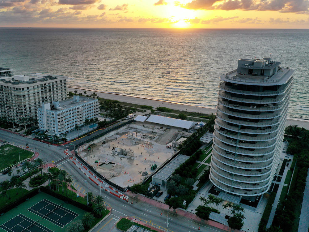 In an aerial view, a cleared lot where the 12-story Champlain Towers South condo building once stood is seen on June 22, 2022, in Surfside, Fla. It had been a year since the tragic event where 98 people died when the building partially collapsed on June 24, 2021.