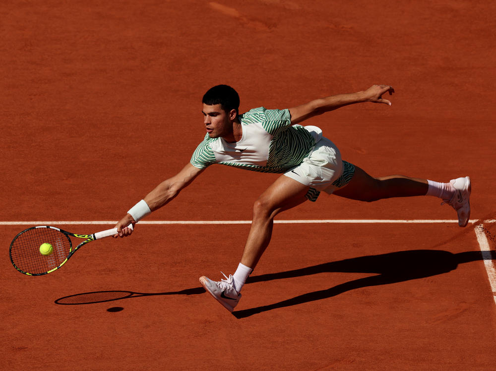 Carlos Alcaraz of Spain plays a forehand against Taro Daniel of Japan during a Second Round Match at the 2023 French Open at Roland Garros on May 31, 2023 in Paris, France.