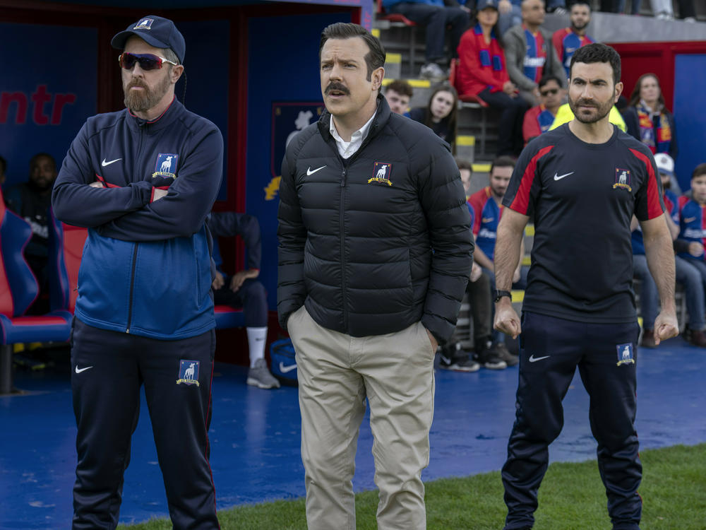 Brendan Hunt, Jason Sudeikis, and Brett Goldstein as Richmond coaches Beard, Ted and Roy.