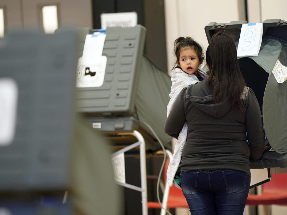 A voter and her daughter cast a ballot in Houston during the 2020 general election. New bills passed by Texas lawmakers target how elections are run in Harris County, which is home to Houston.