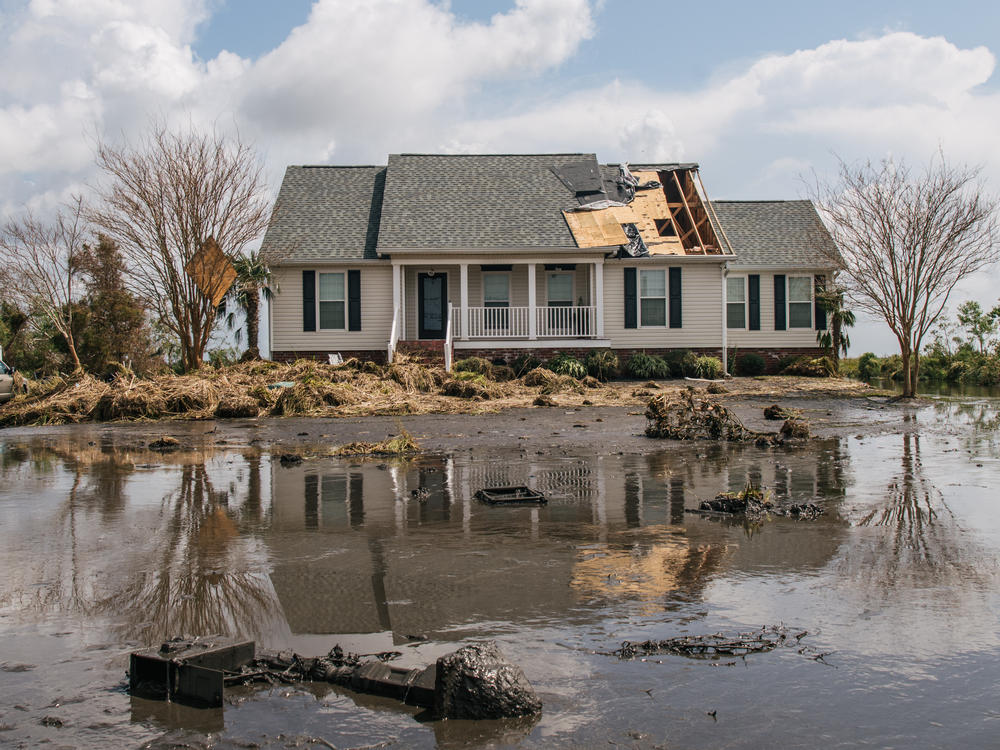 Floodwater surrounds a house on Sept. 1, 2021, in Jean Lafitte, La. Hurricane Ida made landfall as a powerful Category 4 causing flooding and wind damage along the Gulf Coast.