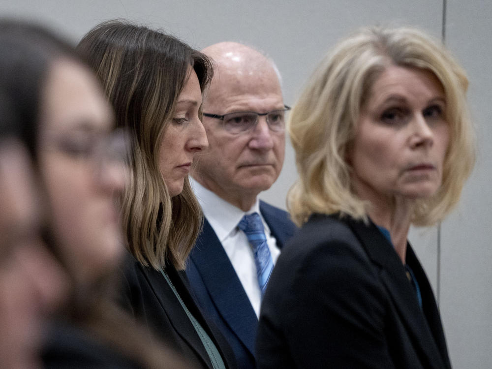 Dr. Caitlin Bernard (center left) sits next to her attorneys during a May 25 hearing before the Indiana Medical Licensing Board in downtown Indianapolis.