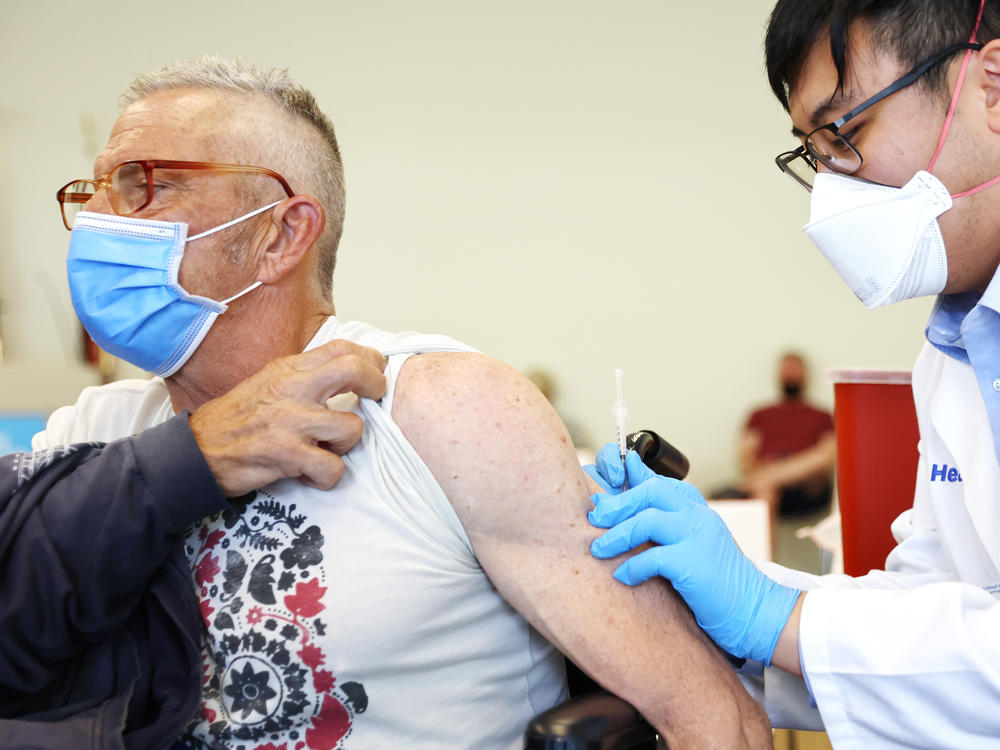 Student pharmacist Charles Liu administered a dose of mpox vaccine at a Los Angeles County Department of Public Health clinic in West Hollywood, Calif., last August.