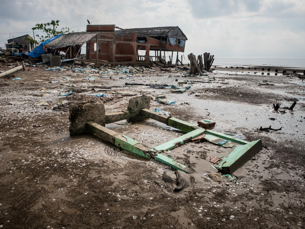 High tides have destroyed roads and structures in Vietnam as rising sea levels threaten farmland in the country's Mekong River Delta.