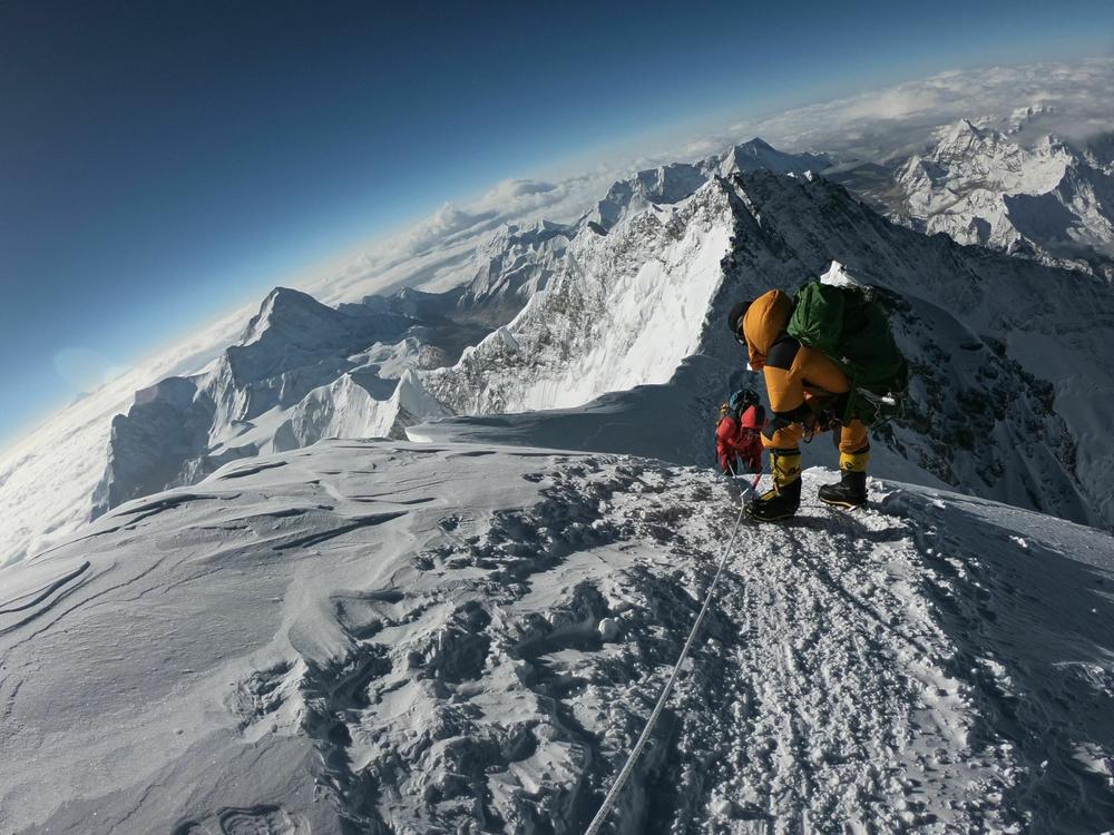 Mountaineers make their way to the summit of Mount Everest, as they ascend on the south face from Nepal on May 17, 2018.