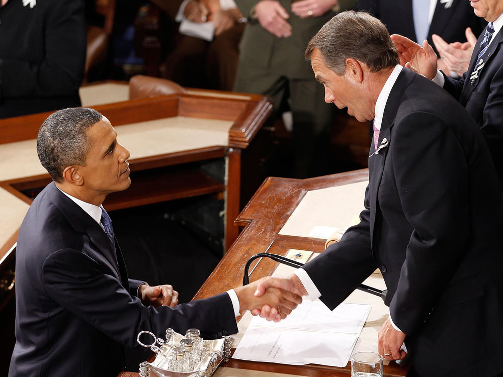 Former President Obama shakes hands with then-House Speaker John Boehner (R) after delivering his State of the Union speech in Washington, D.C., on Jan. 25, 2011.