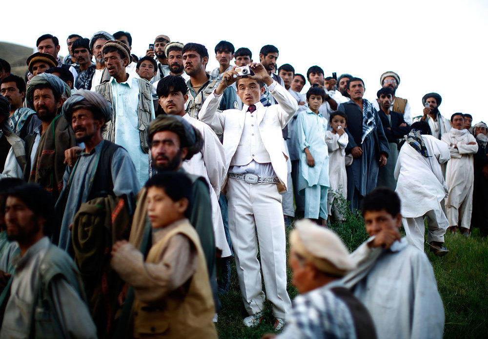 Afghan president Hamid Karzai holds a rally in a remote village<em> </em>in 2009.