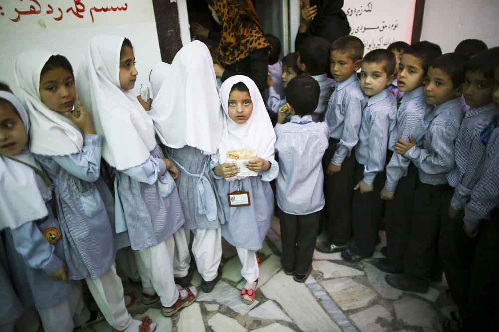 Gilkey would make kids laugh —  and then they'd be willing to let him take their picture. Above: schoolkids in Kabul, Afghanistan, in May 2015.