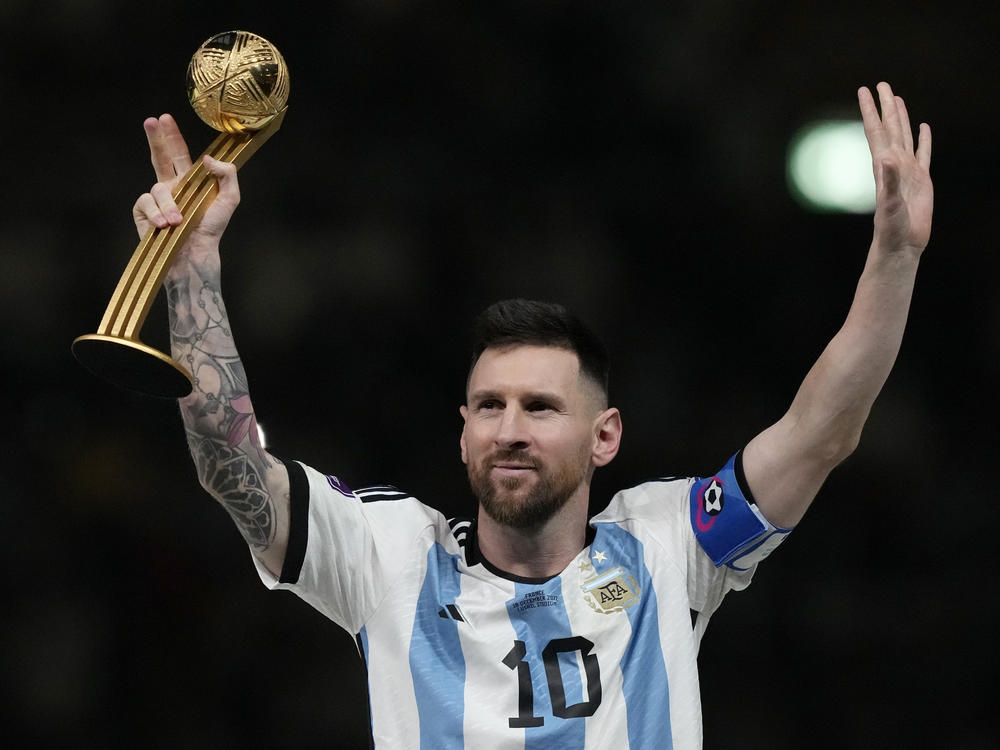 Argentina's Lionel Messi waves after receiving the Golden Ball award for best player at the end of the World Cup final soccer match between Argentina and France at the Lusail Stadium in Qatar on  Dec. 18, 2022.
