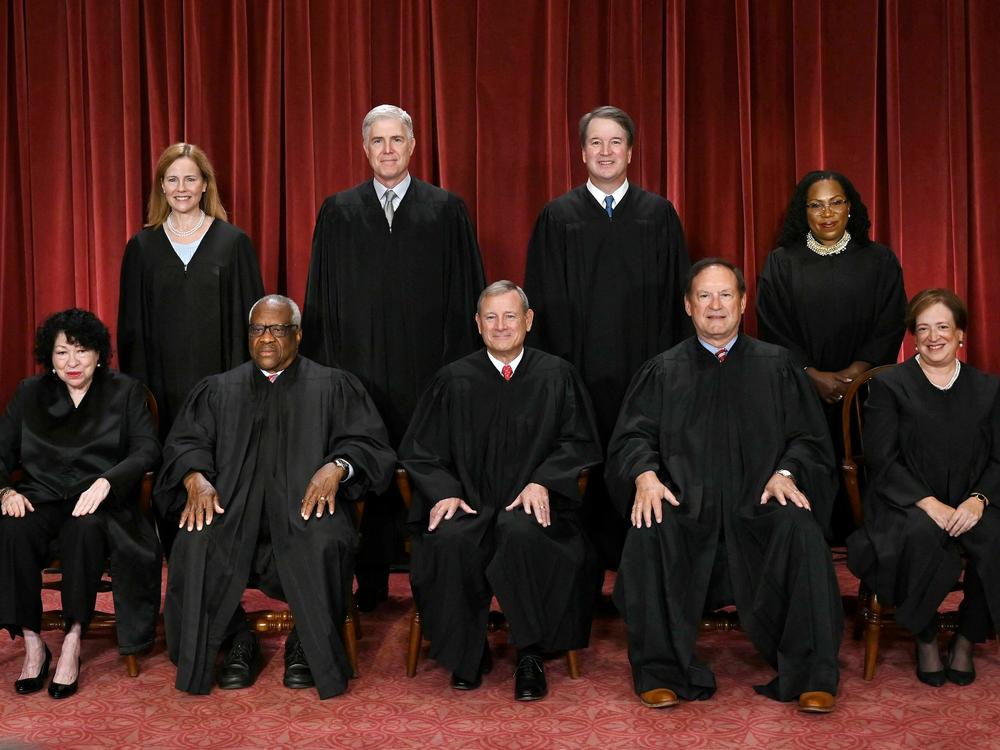 Of the nine justices of the U.S. Supreme Court, only Justice Clarence Thomas (seated second from left) and Justice Samuel Alito (seated fourth from left) did not file their financial disclosures. They asked for — and were granted — extensions.
