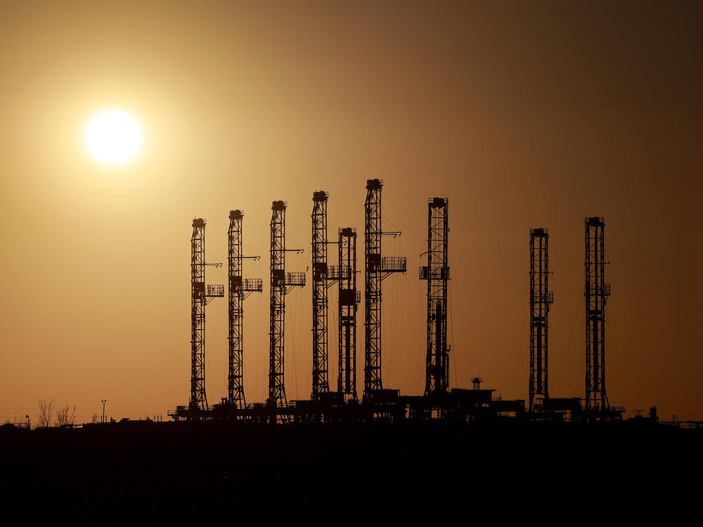 Drilling rigs sit unused on a lot in Odessa, Texas, in the Permian Basin, in March 2022. U.S. oil companies are thriving as they look to avoid the boom-and-bust cycles of the past. That has big implications, including for consumers and global producers.