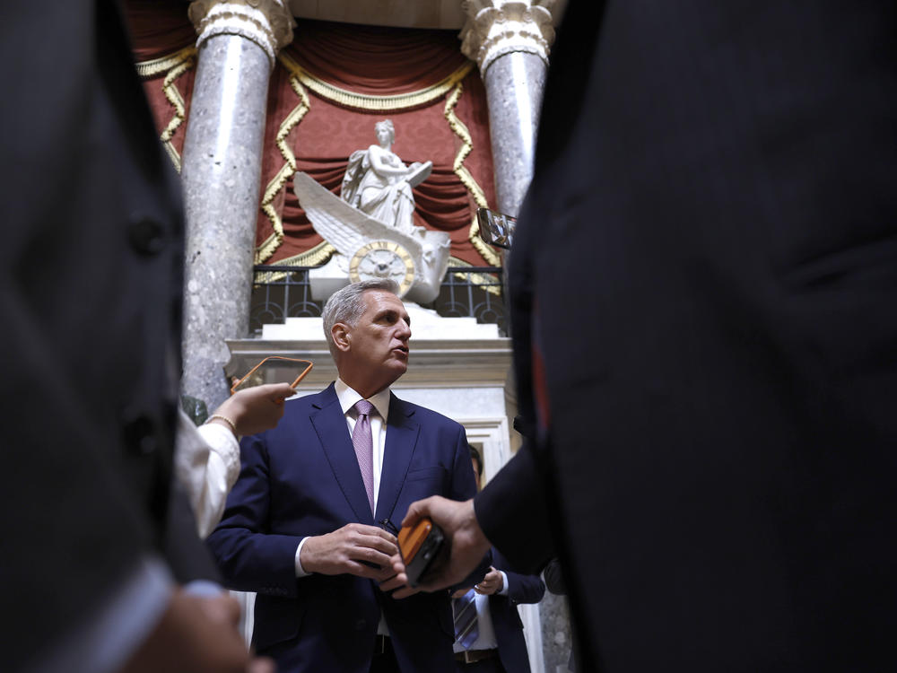 House Speaker Kevin McCarthy speaks to reporters as he walks to the House floor on Tuesday.