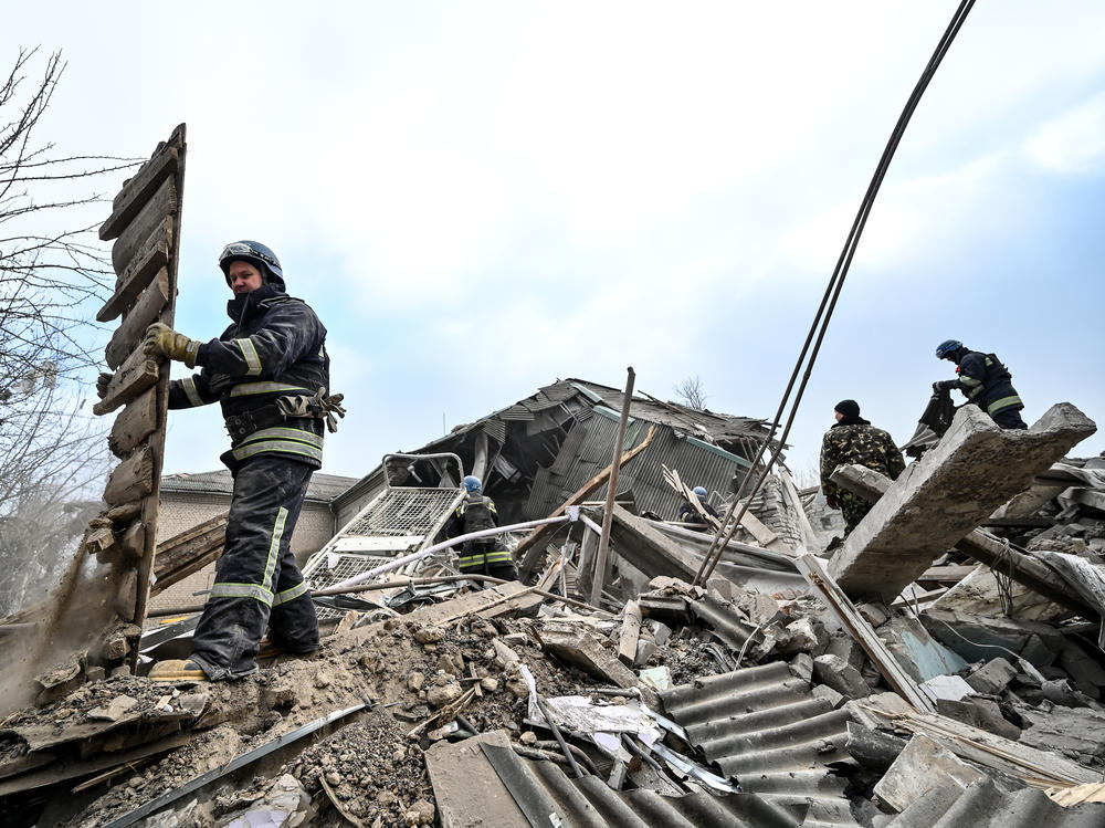 Rescuers remove rubble at the maternity ward of the Vilniansk Multidisciplinary Hospital in Ukraine, one of the countries experiencing an increase in violence against health care workers.