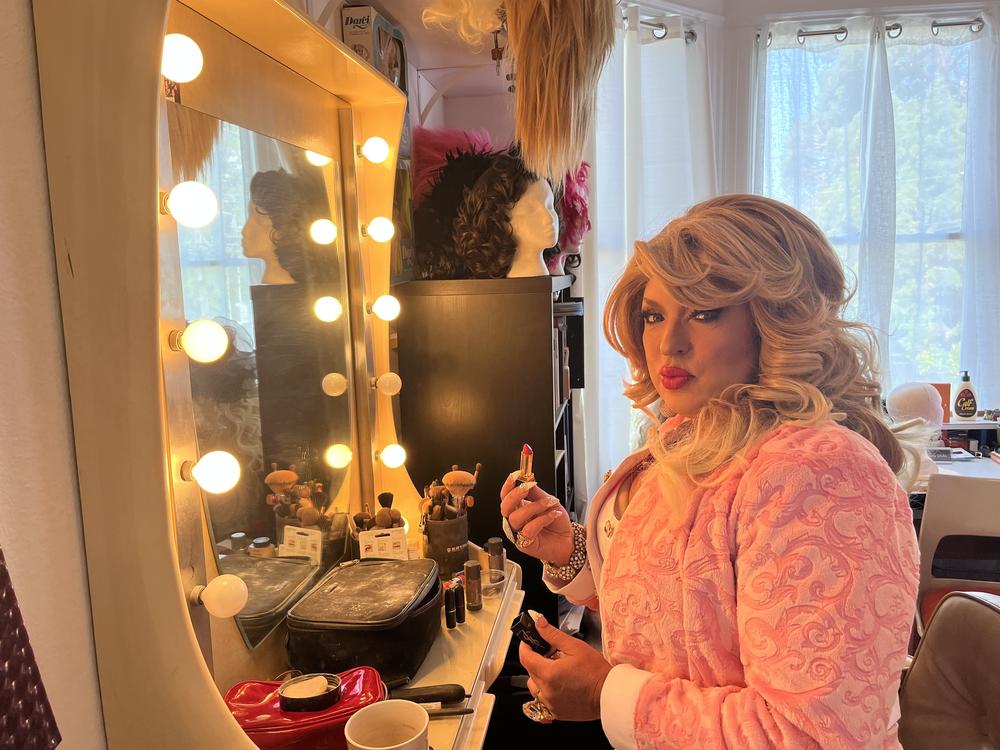 D'Arcy Drollinger applies lipstick at her apartment in preparation for her inaugural appearance as San Francisco drag laureate.