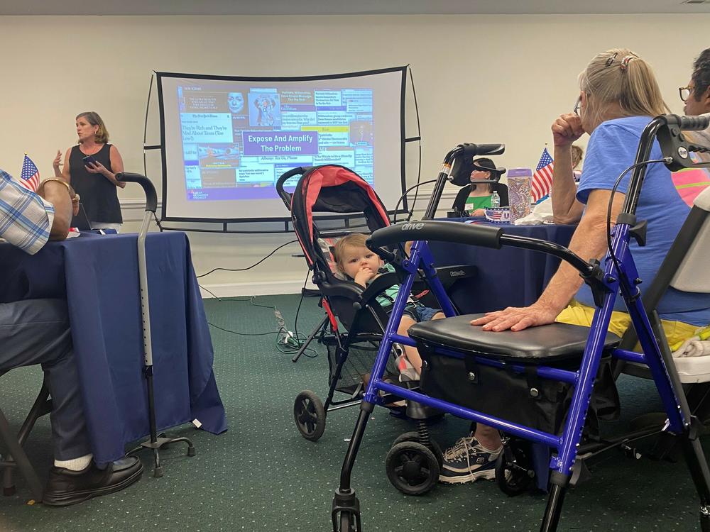 Erica Payne, founder of Patriotic Millionaires, offers a crash course on economic inequality to residents of Whiteville, N.C. The group wants working-class voters to lobby Congress on raising the minimum wage and taxing the rich.
