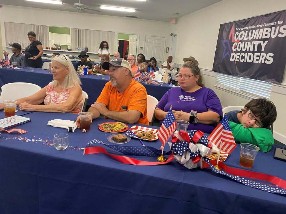 Many people blame themselves for their financial struggles, says Cat Hadley, who directs Patriotic Millionaires' state programs. She says the group's meetings aim to pull back the curtain and show the larger forces at work that drive inequality.