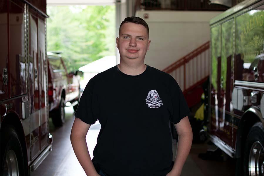 Ben Shrader, 20, stands in the engine bay at Darlington Volunteer Fire Company's fire station 2 in Street, Maryland.