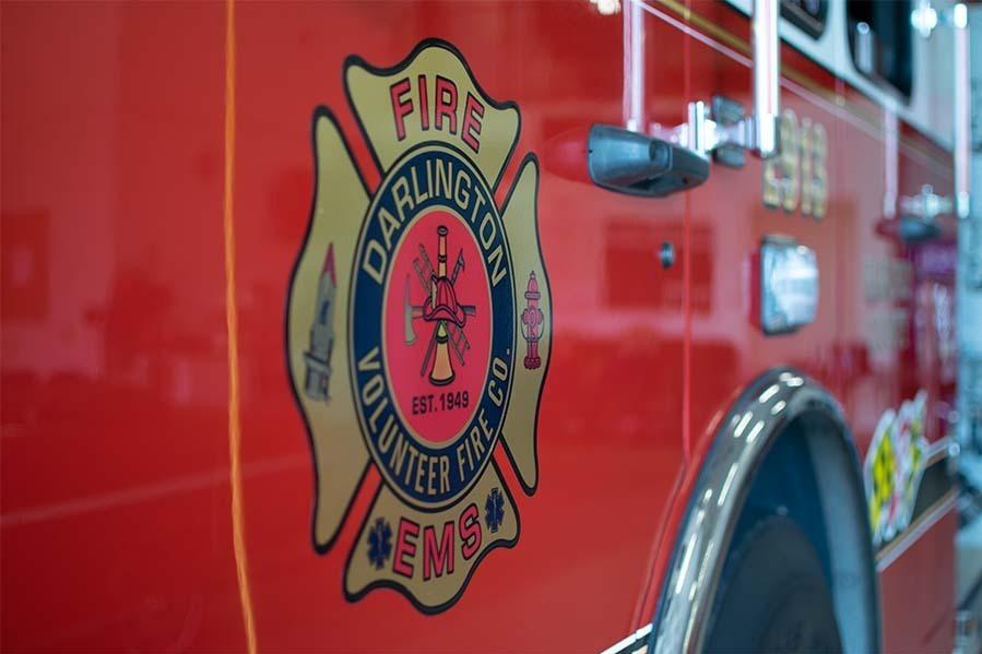 Darlington Volunteer Fire Company's crest is seen on the door of a fire engine at the department's fire station 2 in Street, Maryland.
