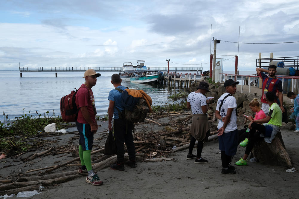 Migrants primarily from Venezuela are on a beach in the town of Necoclí, Colombia. They will stay until they come up with the $350 it costs for a boat ride across the Gulf of Urabá to the Colombian town of Acandí.