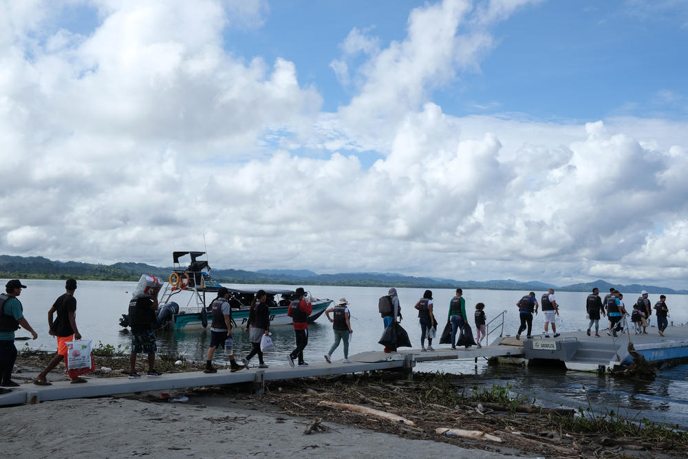 Migrants, most from Venezuela, board a boat that will take them to the towns of either Acandí or Capurganá, depending on which route they choose to cross in the Darien Jungle.