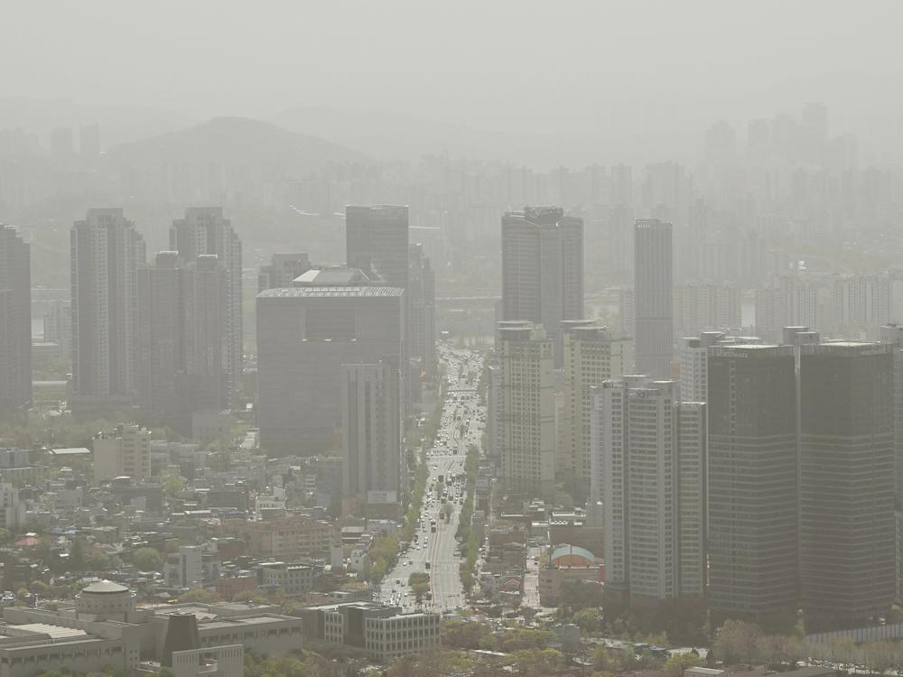 A general view showing buildings shrouded by polluted air in Seoul on April 12, 2023.