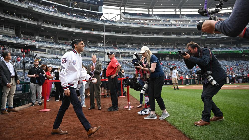 Sunak walks onto the baseball field at Nationals Park. The British prime minister is in Washington in part to focus on 