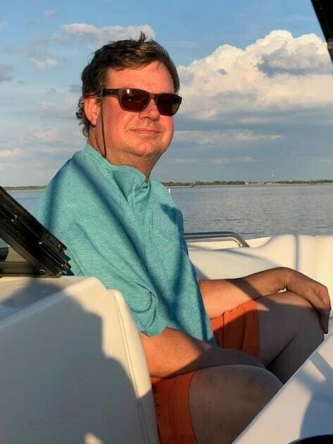 When Wade Goodwyn wasn't working, he had four loves — his family, playing golf, riding motorcycles and spending time on his boat.