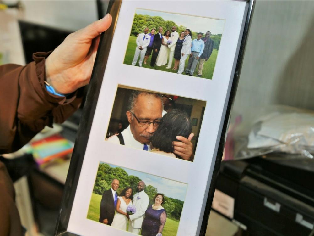 Sharon Gwinn holds a picture of her husband, who had Lewy body dementia toward the end of his life. Reckless financial behavior was one of the first signs of the disease. 