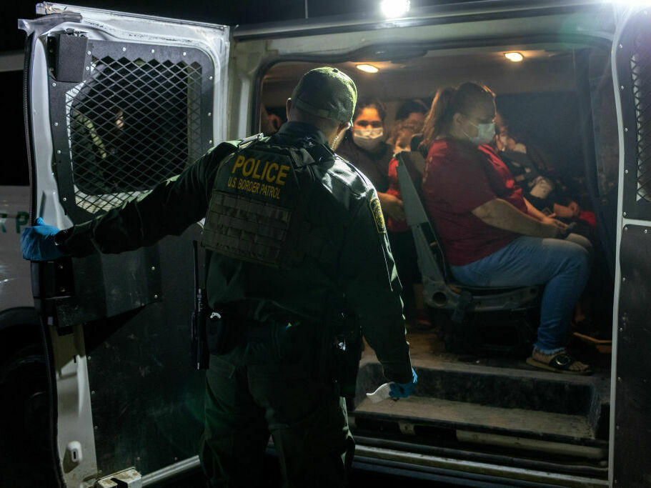 Venezuelan migrants board a U.S. Border Patrol vehicle after crossing the Rio Grande River on May 18, 2021, in Del Rio, Texas.