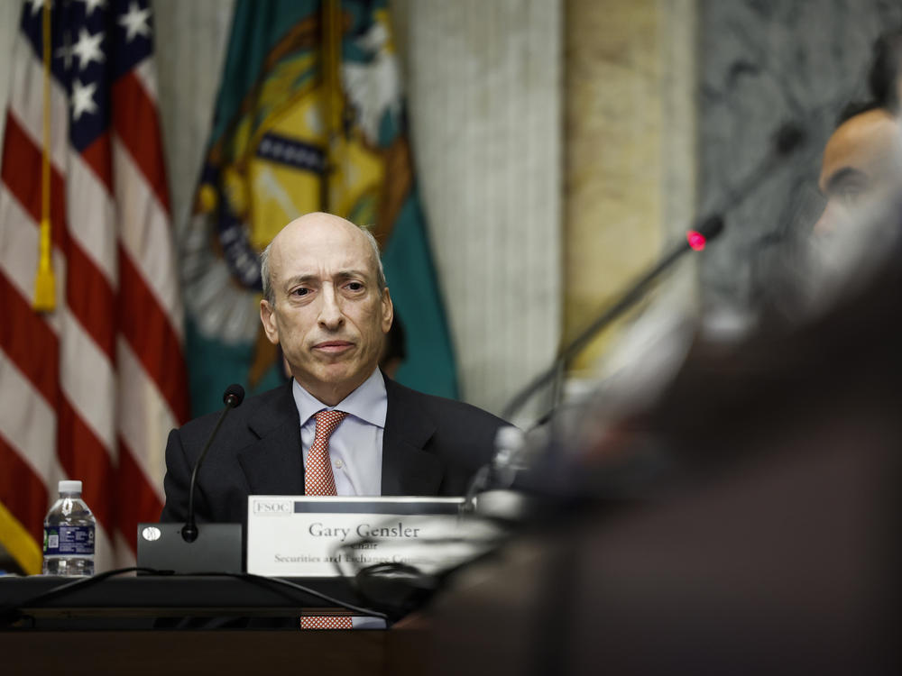 Securities and Exchange Commission Chair Gary Gensler listens during a meeting of top financial regulators at the U.S. Treasury Department on Oct. 3, 2022, in Washington, D.C. The SEC's lawsuit against crypto exchanges Binance and Coinbase this week are intended to bring both under the regulatory purview of the agency.