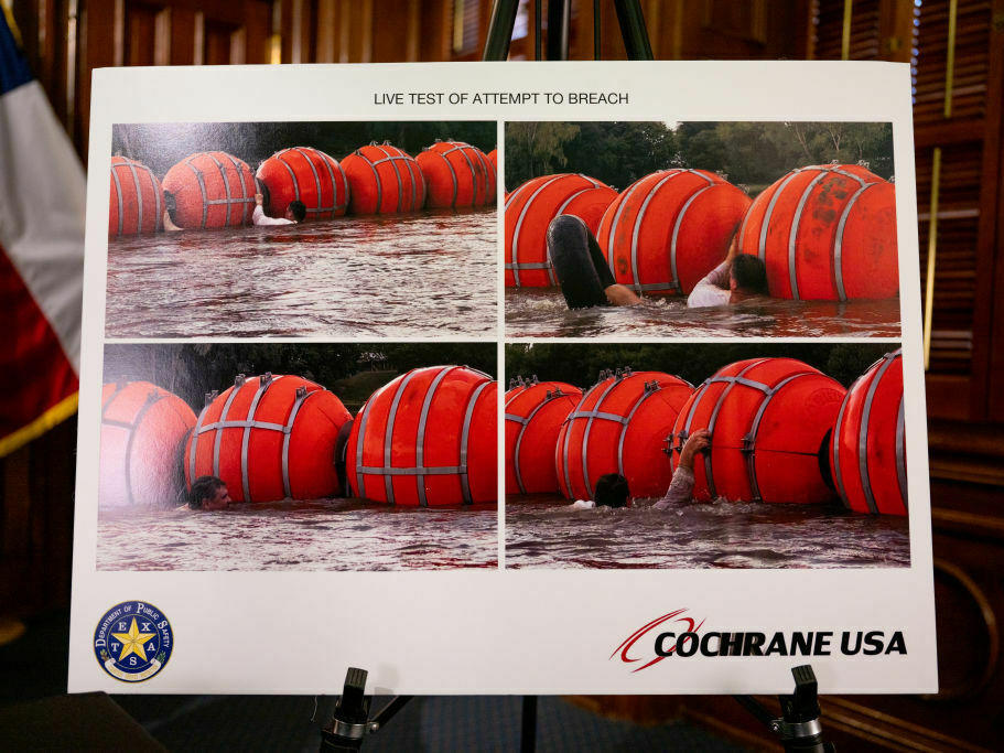 A poster illustrating a new border security measure is displayed during a news conference at the Texas State Capitol in Austin on Thursday.
