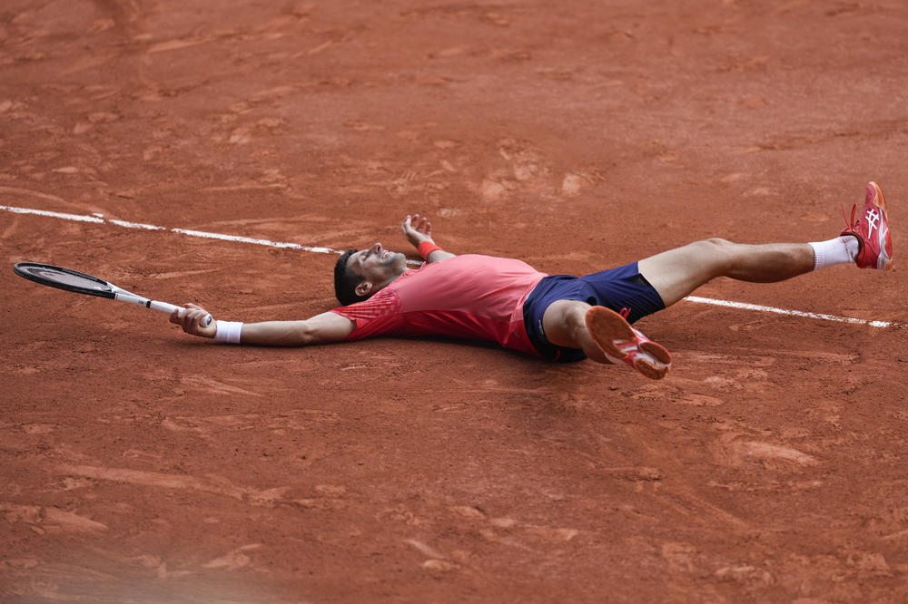 Serbia's Novak Djokovic celebrates winning the men's singles final match of the French Open tennis tournament against Norway's Casper Ruud in three sets, 7-6, (7-1), 6-3, 7-5, at the Roland Garros stadium in Paris on Sunday.