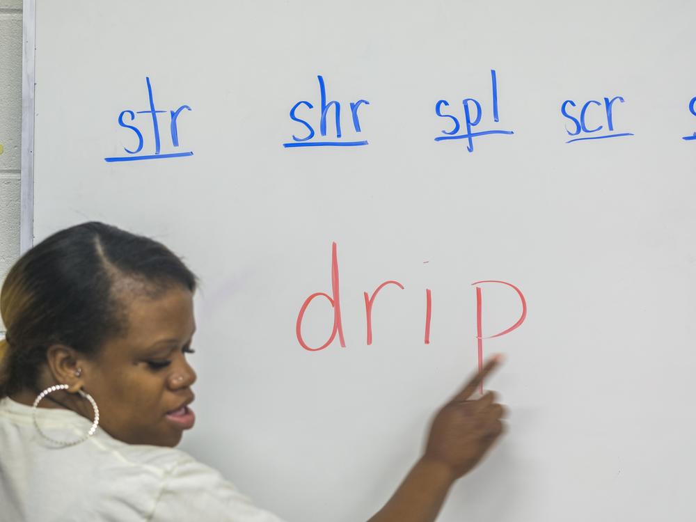 Quantesha Pittman explains blends, or sounds made when two or more letters are put next to each other, to third grade students at John R. Lewis Elementary School in Macon, Ga., recently.