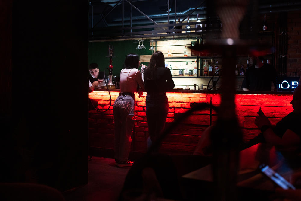 Liquor beer and hookah flow from the bar through the night.