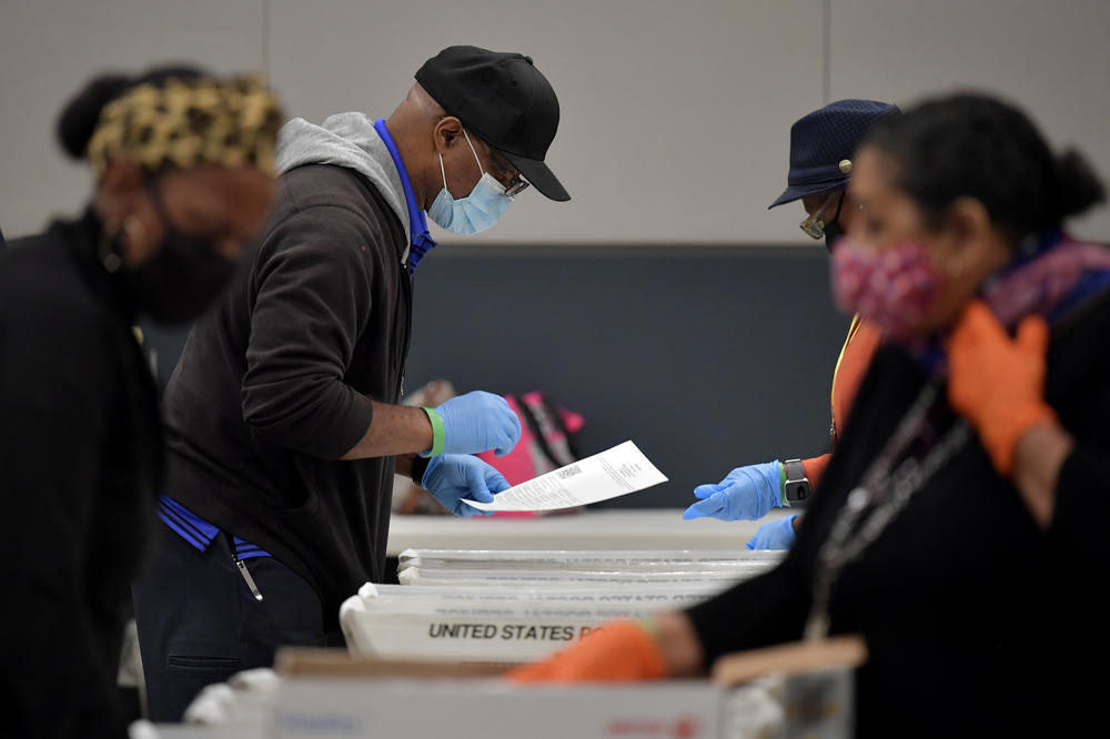 Cobb County election officials sort ballots during an audit on Nov. 13, 2020, in Marietta, Ga.