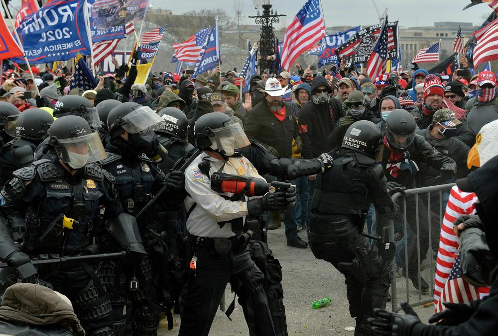 Trump supporters clash with police and security forces as they storm the U.S. Capitol on Jan. 6, 2021.