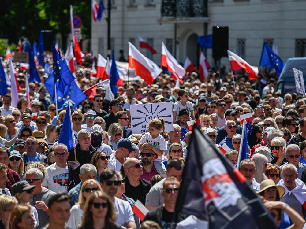 Supporters of Poland's opposition parties hold European Union, Polish flags and banners during a march organized by Civil Platform on June 4, in Warsaw, Poland.
