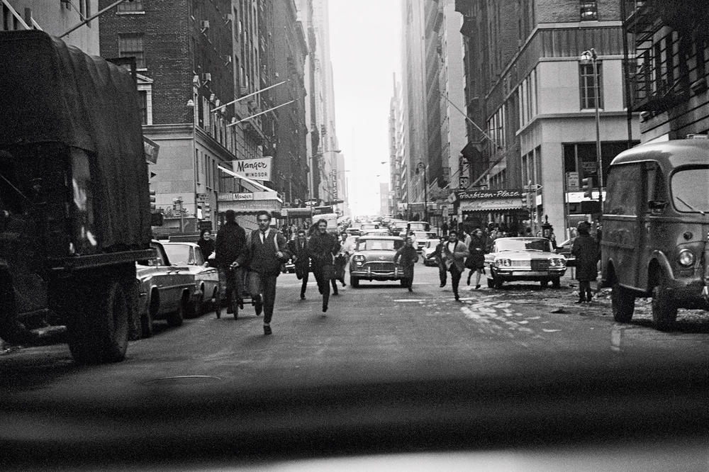 Beatles fan in New York, February 1964. Taken out of the back of the Beatles' car on West Fifty-Eighth, crossing the Avenue of the Americas.