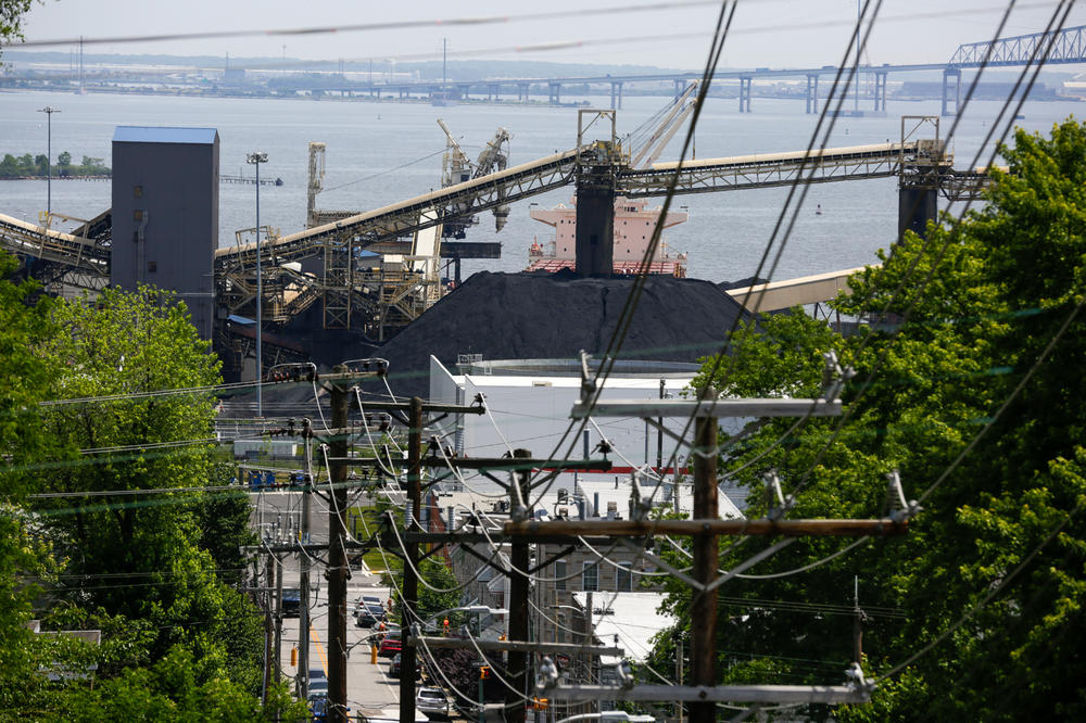 Piles of coal sit at a coal export terminal in the Curtis Bay neighborhood of Baltimore. The area is one of the most polluted in the state and is one of hundreds of communities in the U.S. that grapple with disproportionate air pollution.