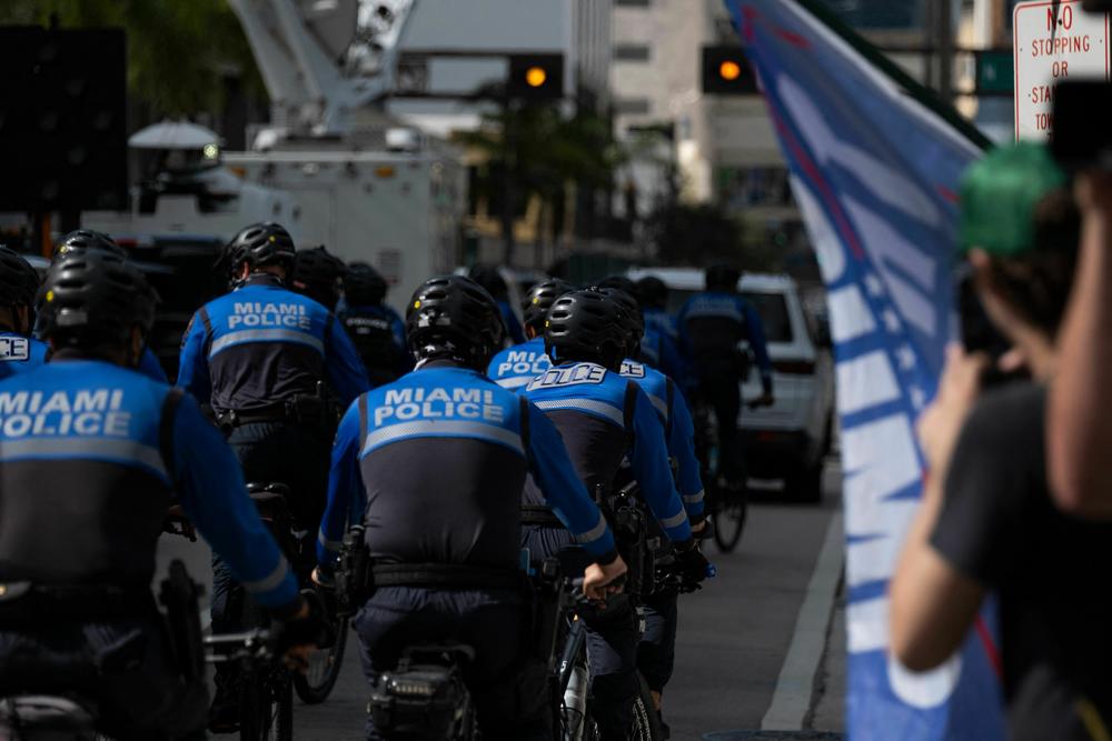 Miami Police Officers ride around the Wilkie D. Ferguson Jr. United States Federal Courthouse.