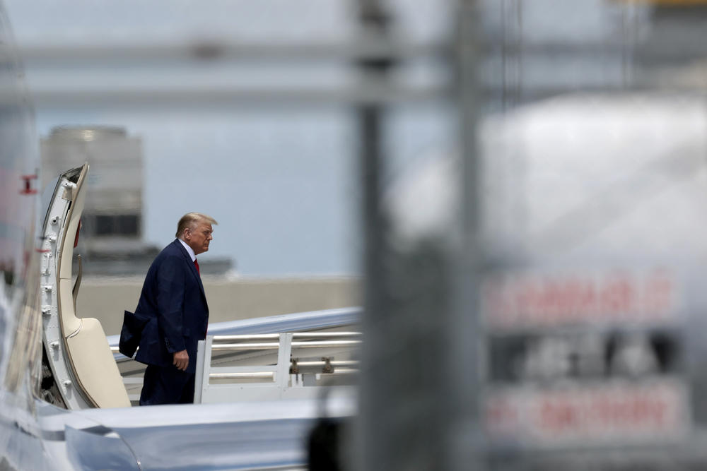 Former President Trump arrives at the Miami International Airport on June 12, 2023.