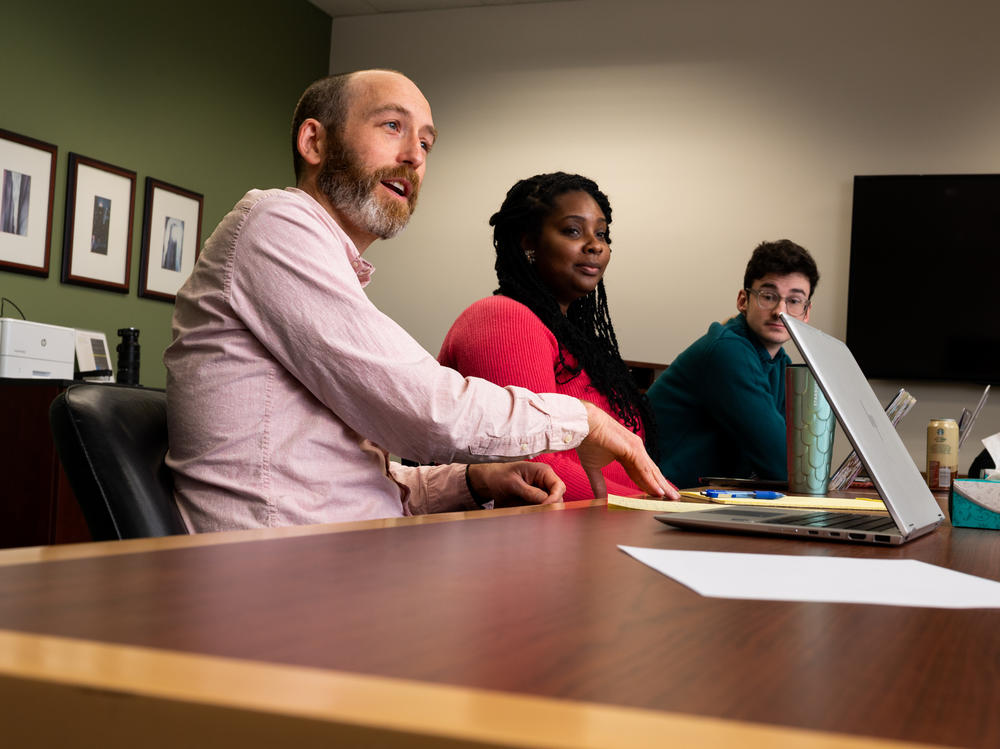 Justin Simard, Michigan State University College of Law, meets with his students about the Citing Slavery Project.