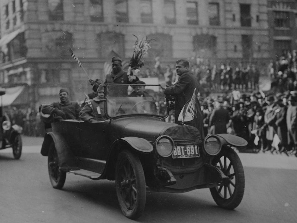 Sgt. Henry Johnson waves to well-wishers as the 369th Infantry Regiment march up Fifth Avenue during a welcome-back parade in New York City on Feb. 17, 1919.