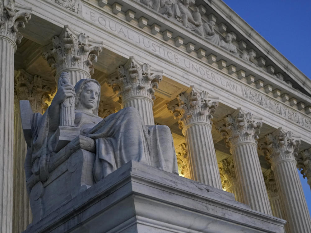 Light illuminates part of the Supreme Court building in Washington on Nov. 16, 2022.