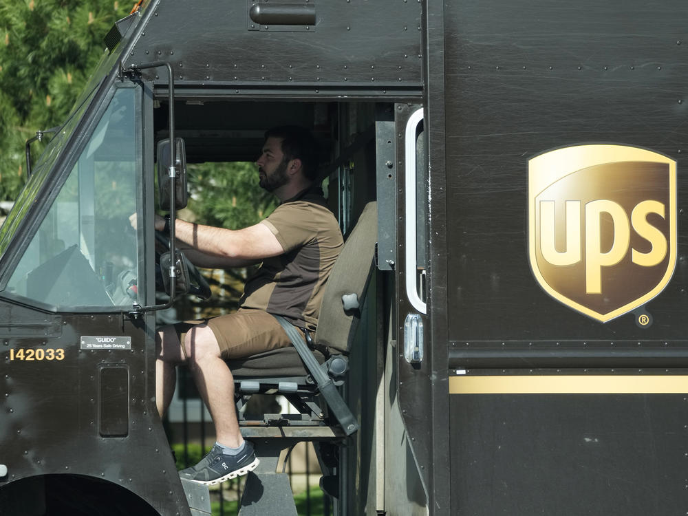 A UPS driver makes deliveries in Northbrook, Ill., on May 10.