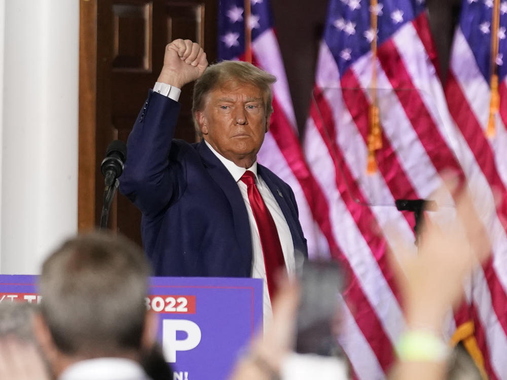 Former President Donald Trump gestures after speaking at Trump National Golf Club in Bedminster, N.J., Tuesday after pleading not guilty in a Miami courtroom earlier in the day to dozens of felony counts that he hoarded classified documents and refused government demands to give them back.