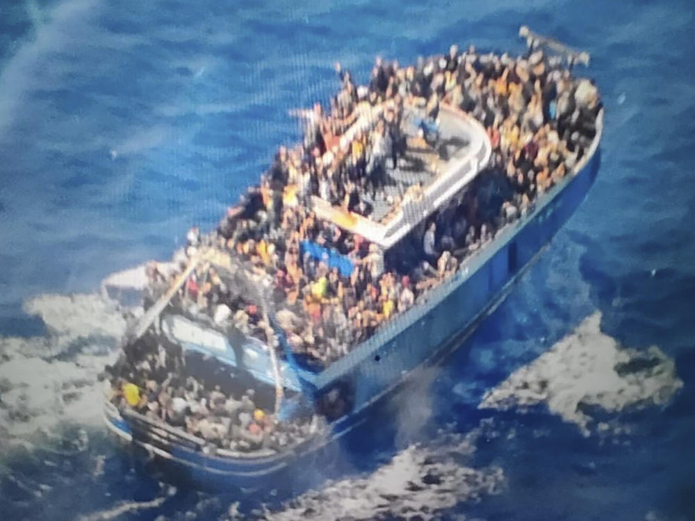This undated handout image provided by Greece's coast guard on Wednesday, June14, 2023, shows scores of people covering practically every free stretch of deck on a battered fishing boat that later capsized and sank off southern Greece.